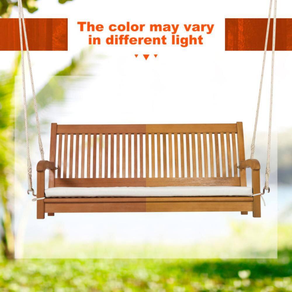 Natural wood hanging porch swing chair showing color variation in light.