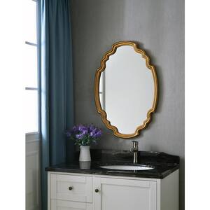 Medium Oval Gold Finish Hooks Modern Mirror (24.5 in. H x 35.5 in. W)