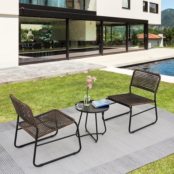 3-Piece Brown Wicker Outdoor Bistro Set and a Table