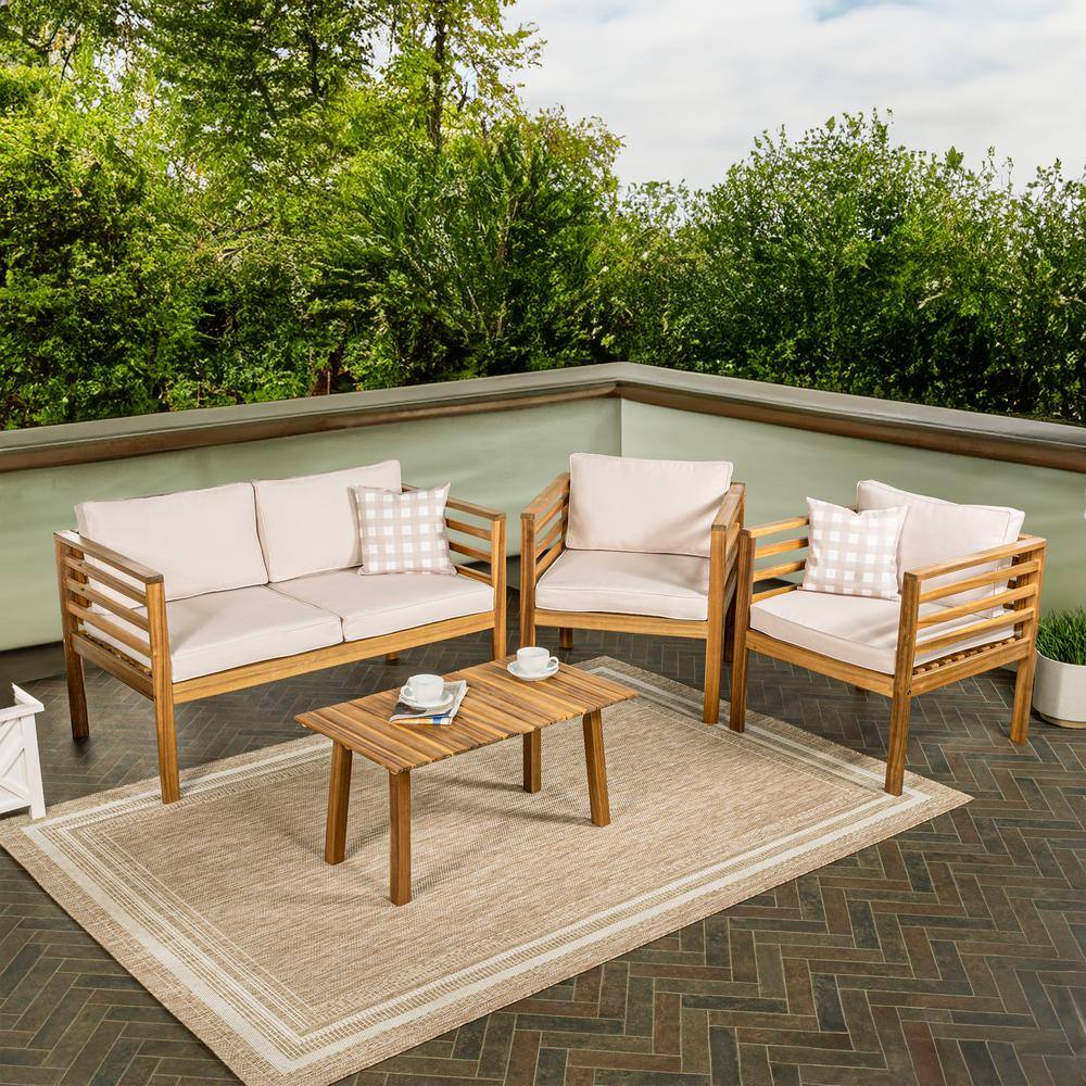 Thom 4-piece acacia wood patio set arranged on an outdoor terrace.