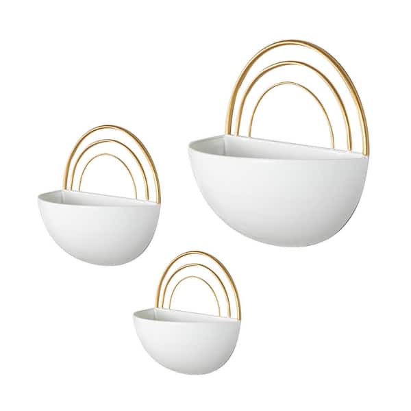 https://images.thdstatic.com/productImages/f51a53ec-a4d8-4cff-8c18-26dfcd66e8cb/svn/white-gold-danya-b-wall-planters-fhb21655-40_600.jpg