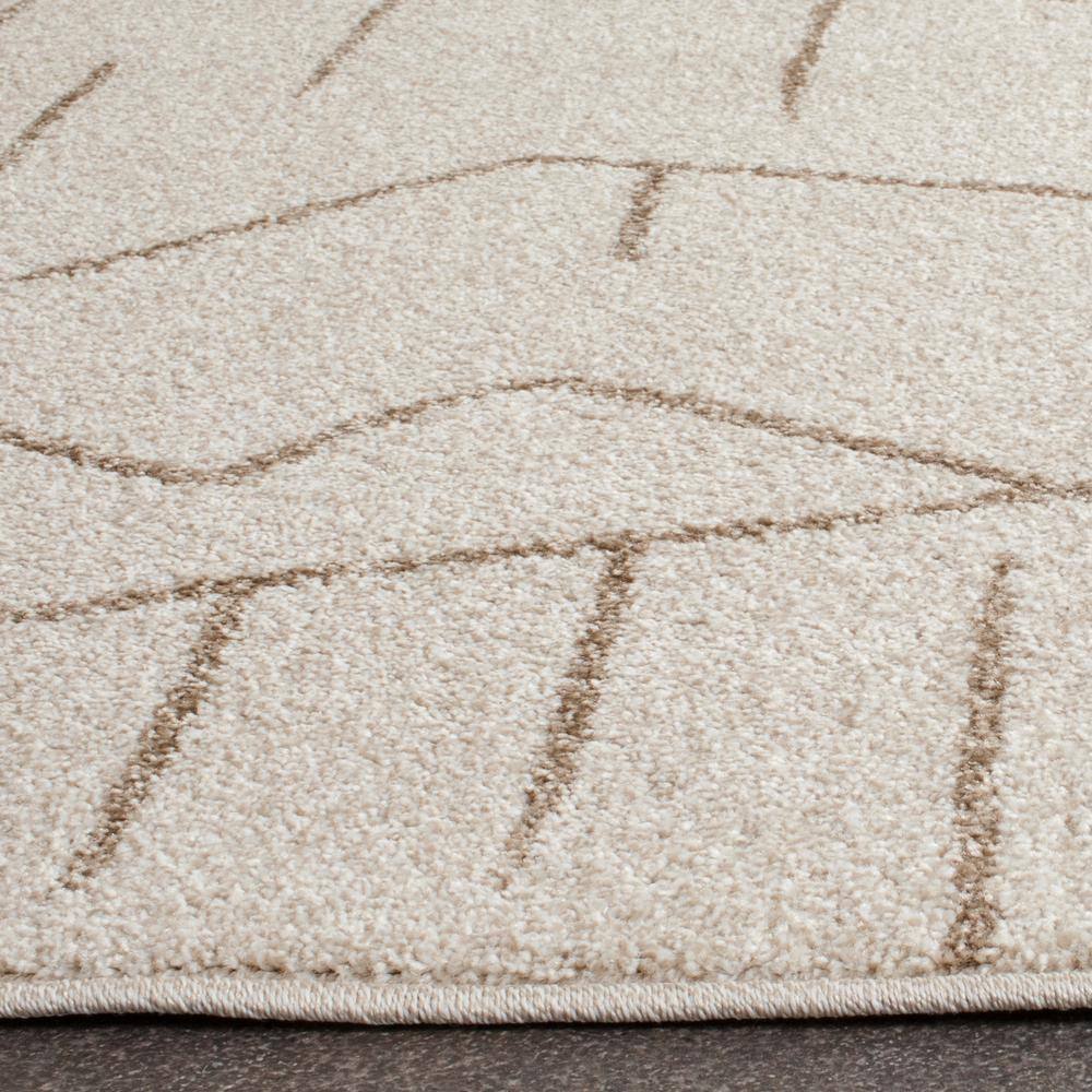 Ivory Geometric Easy-Care 8' x 10' Synthetic Area Rug
