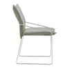 Single modern dining chair with light green upholstery.