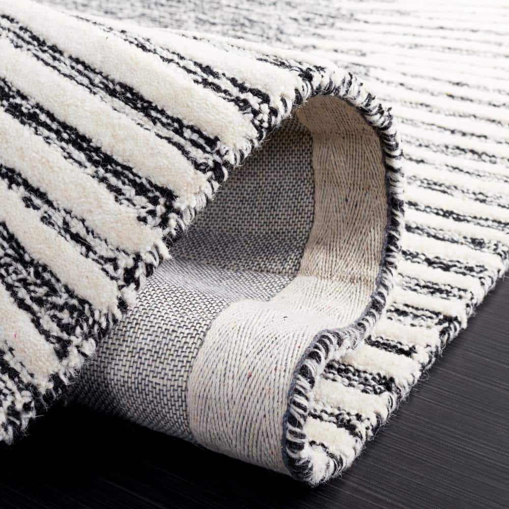 Handmade Abstract Tufted Wool Rug in Black/Ivory - 6' x 9'