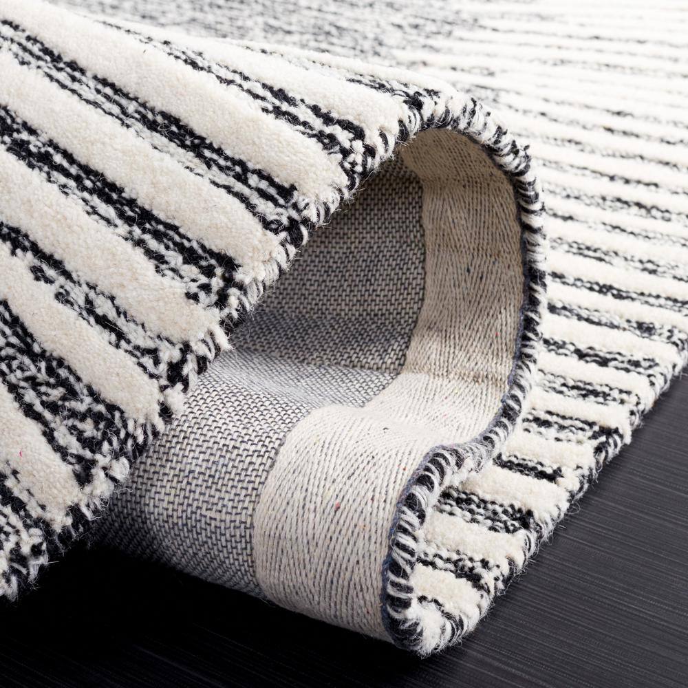Black and Ivory Abstract Handmade Wool Tufted Rug, 8' x 10'