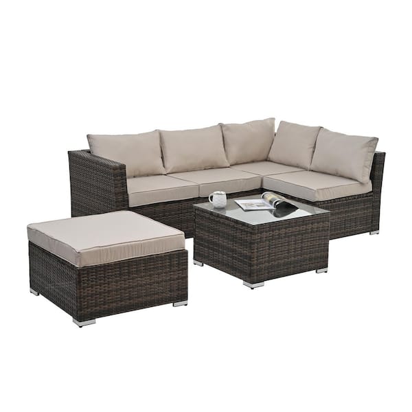 Unbranded 4-Piece Brown Wicker Outdoor Sectional Set with Glass Top Table and Beige Cushions