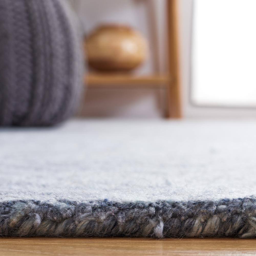 Handmade Blue Abstract Tufted Wool Rectangular Rug 27" x 4"