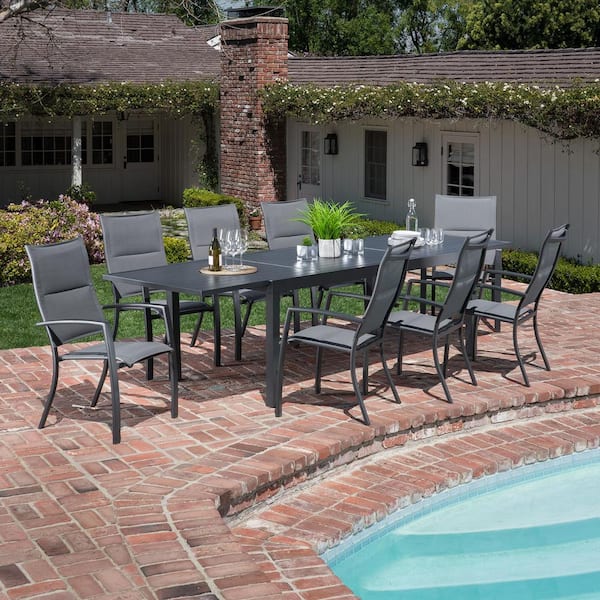 Hanover Naples 9-Piece Aluminum Outdoor Dining Set with 8 Padded Sling Chairs and a 40 in. x 118 in. Expandable Dining Table