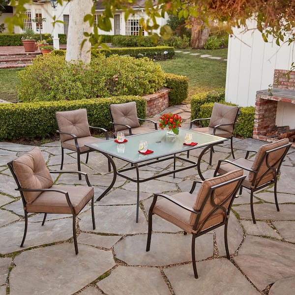 Hanover Palm Bay 7-Piece Steel Outdoor Dining Set with Copper Brown Cushions, 6 Chairs and 38 in. x 60 in. Glass Top Table