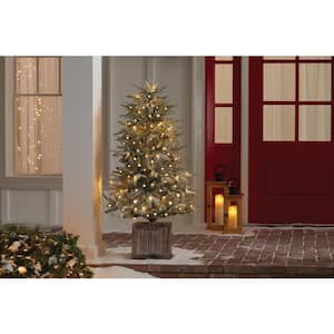 4.5 ft Pre-Lit Potted Artificial Christmas Tree with 100 Warm White Lights