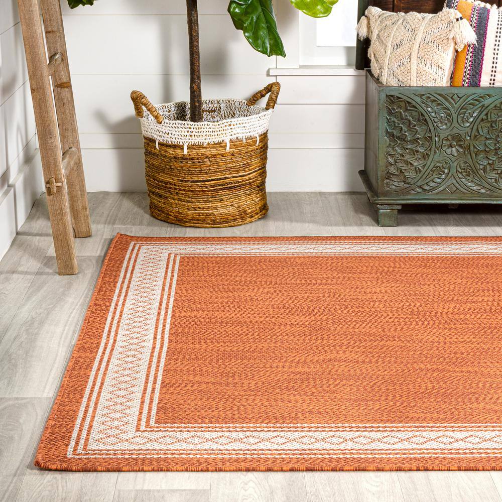 Lucia Cream and Orange Synthetic Indoor/Outdoor Area Rug