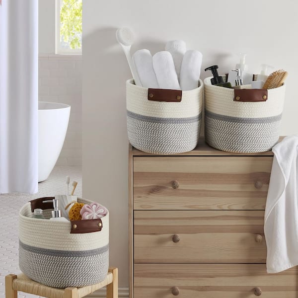 https://images.thdstatic.com/productImages/f6c1fd49-3f6a-410a-99fd-8bbd4bbe419c/svn/white-gray-storage-baskets-3pk-15x10x9-white-gray-c3_600.jpg
