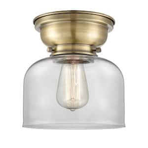 Bell 8 in. 1-Light Antique Brass Flush Mount with Clear Glass Shade