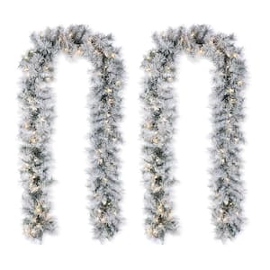 9 ft. Prelit Snow Flocked Greenery Pine Christmas Garland, with 70 Warm White/Multi-Color Lights and Timer (Set of 2)