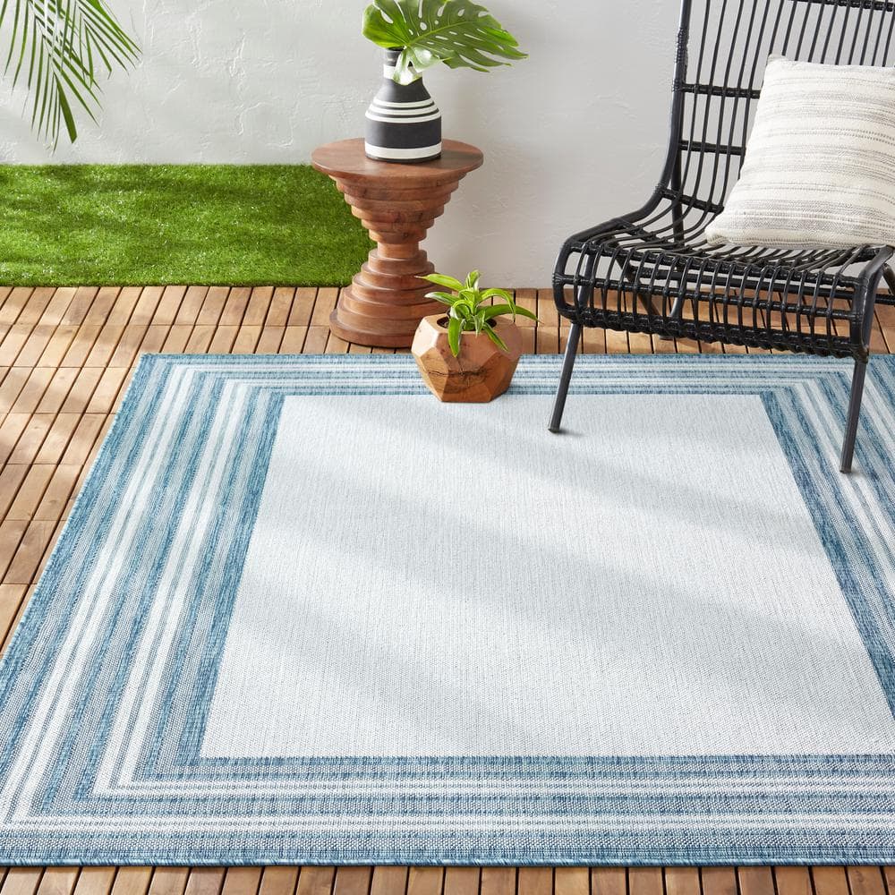 Blue and Ivory Striped Synthetic Indoor/Outdoor Area Rug