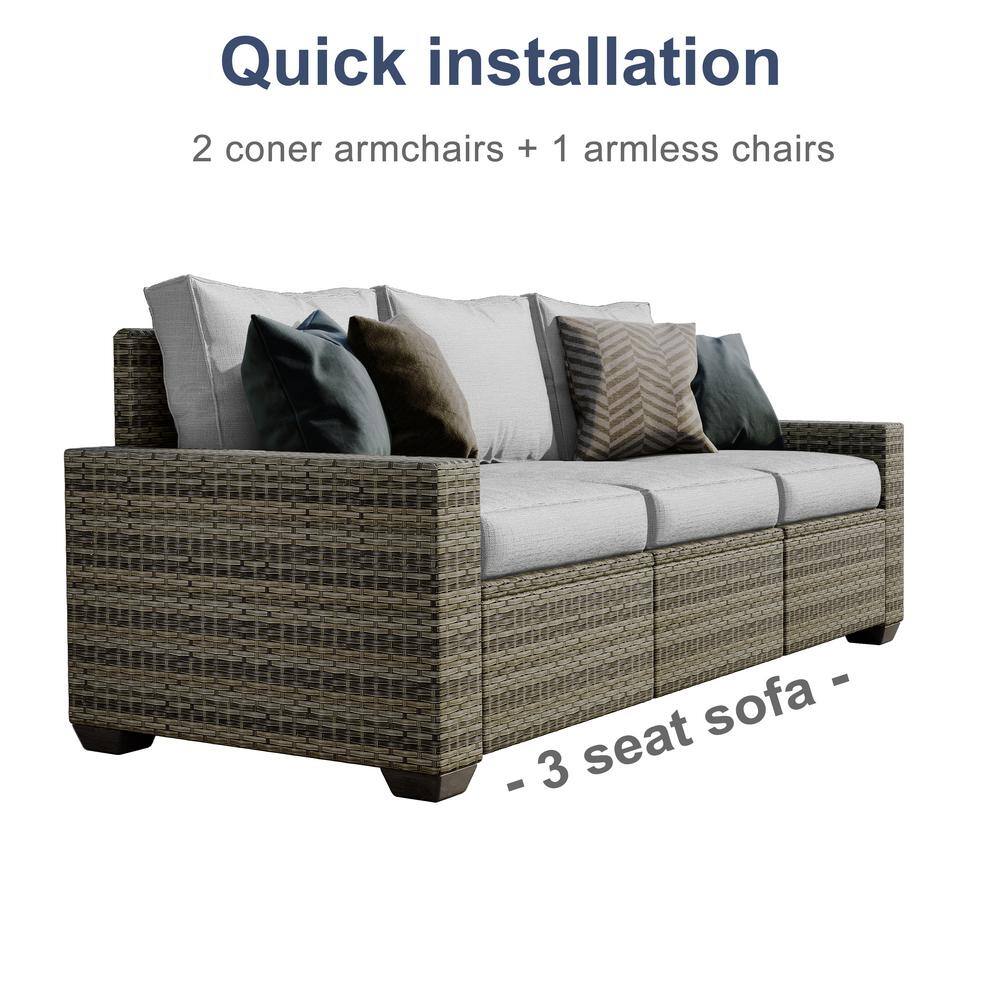 Close-up of the three-seat rattan sofa with light gray cushions.