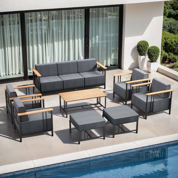 Puffin 8-Piece Black Metal Patio Conversation Set with Sofa, Armchairs, and 10 in. Thick Dark Gray Olefin Cushions
