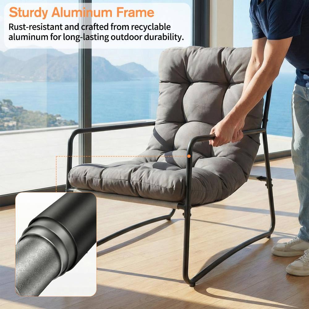 A person touching the armrest of a metal patio lounge chair, highlighting the aluminum frame.