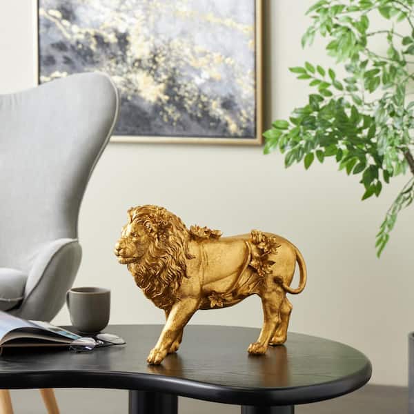 Litton Lane 18 in. x 13 in. Gold Resin Walking Lion Sculpture with Floral Accents