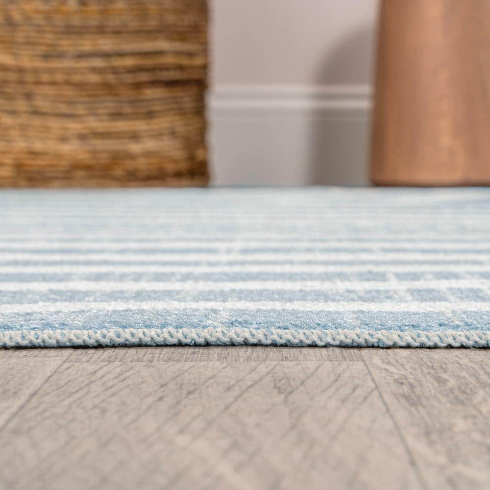 Blue and Cream Abstract Synthetic 4' x 6' Washable Area Rug