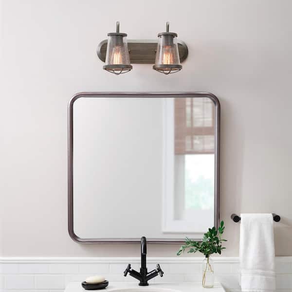 Home Decorators Collection Georgina 18 in. 2-Light Weathered Iron Industrial Rustic Vanity with Clear Seeded Glass Shades and Cage Accents