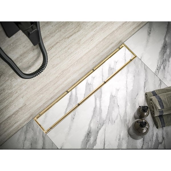 https://images.thdstatic.com/productImages/f7ba2aba-032e-402f-9405-3351219346b8/svn/zirconium-gold-plating-elegante-drain-collection-shower-drains-kd01a110-36-zgp-77_600.jpg