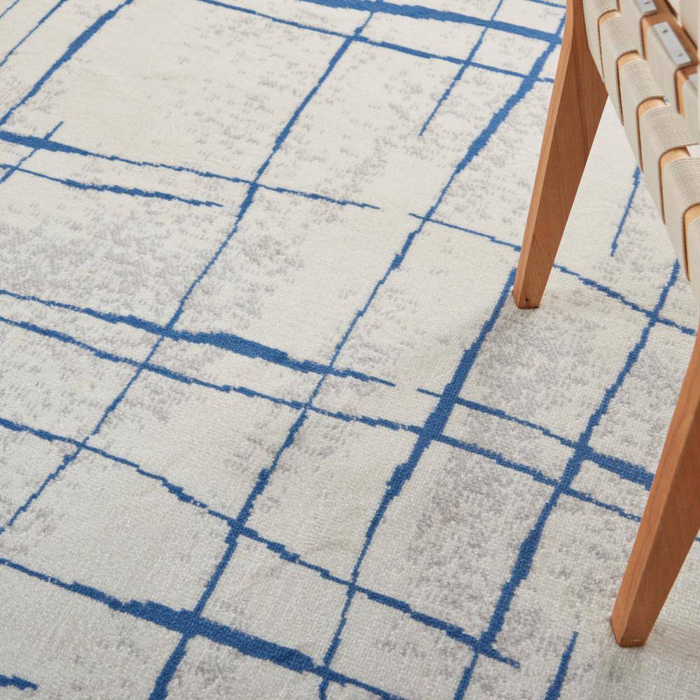 Ivory Abstract Linear 6' x 9' Machine-Made Synthetic Area Rug