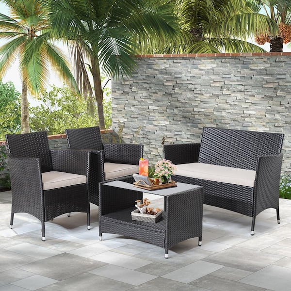 Liviza 4 Pieces Wicker Patio Conversation Set with Beige Cushions and Glass Tabletop
