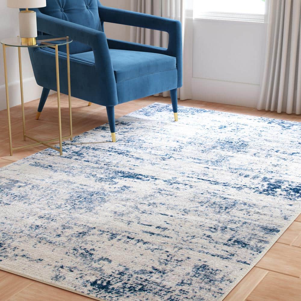 Amelia Ivory and Navy Abstract Synthetic Area Rug, 12' x 18'