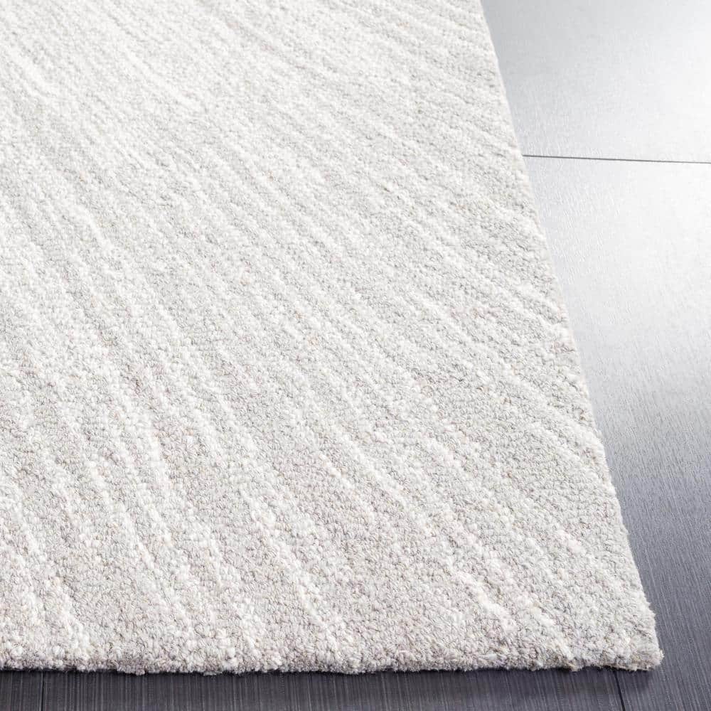 Ivory and Silver Tufted Wool Abstract 4' x 6' Rug