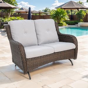 Brown PE Wicker Outdoor Loveseat with Beige Cushions and Glide Function