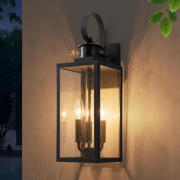 19 in. Motion Sensing Dusk to Dawn Black Outdoor Hardwired Wall Lantern Sconce with Seeded Glass and No Bulbs Included