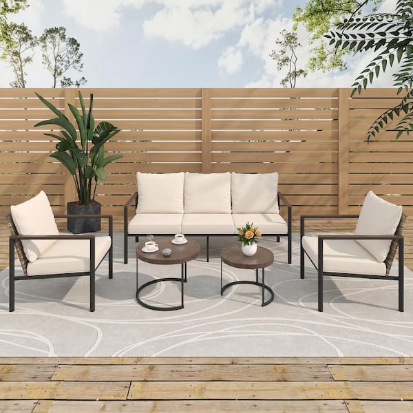 4-Piece Wicker Outdoor Patio Conversation Set with Beige Cushions, 3-Seater Sofa, Armchairs, and Nesting Coffee Tables