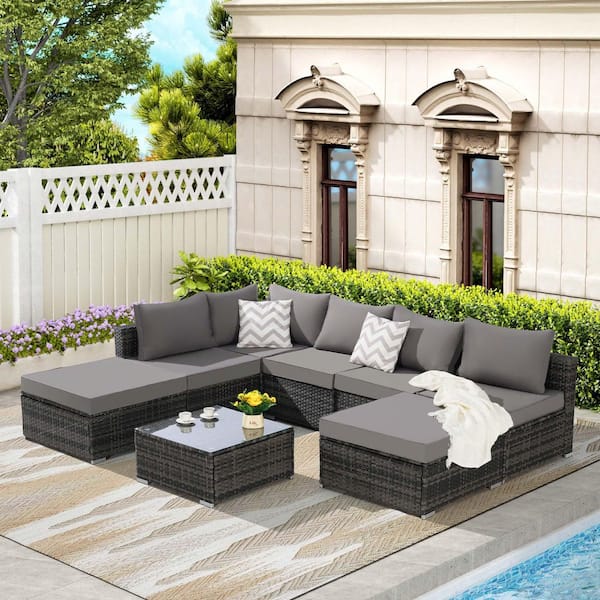 Zeus & Ruta 8-Piece Gray Wicker Half-Moon Outdoor Sectional Sofa Set with Dark Blue Cushions and 1 Glass Square Coffee Table