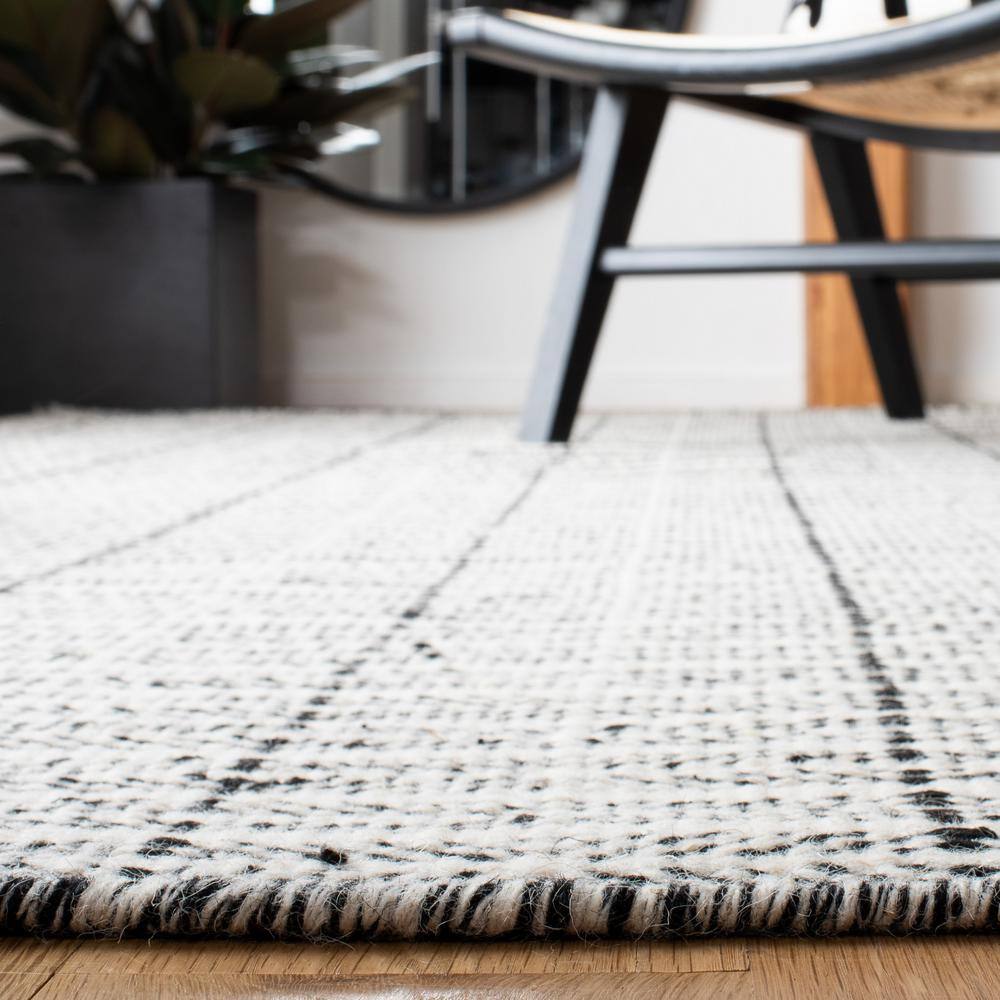 Handmade Black and Ivory Wool Tufted Reversible Area Rug, 9' x 12'
