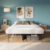 Platform bed with metal frame base in a bedroom.