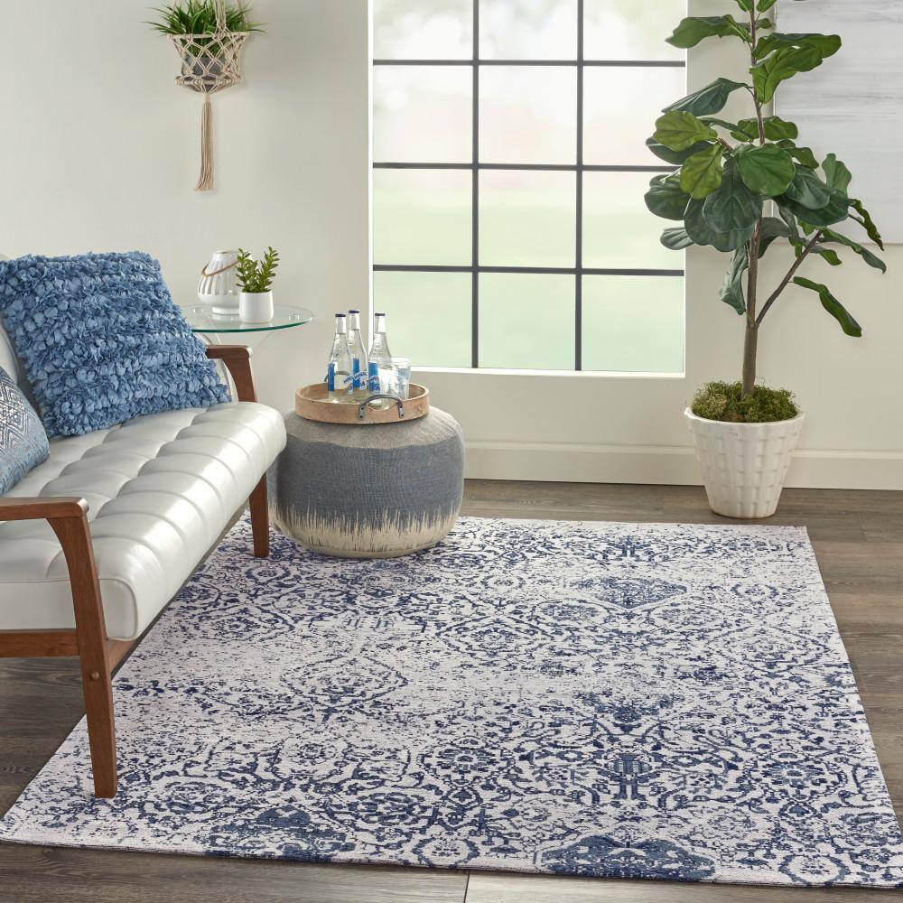 Ivory and Navy Floral Synthetic Large Rectangular Rug
