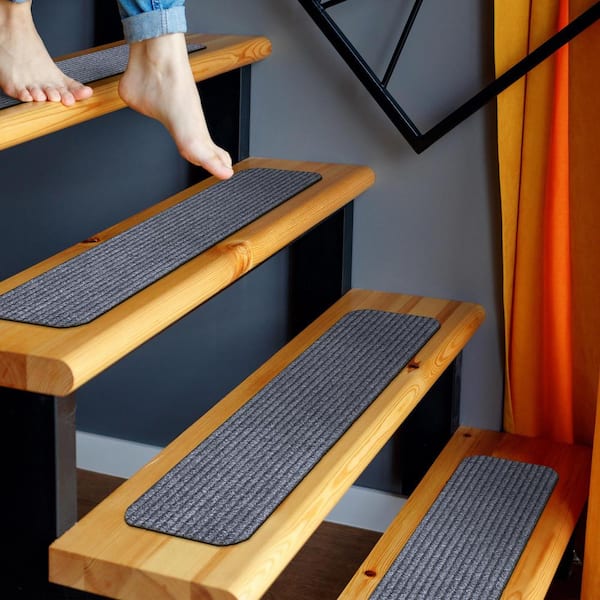 https://images.thdstatic.com/productImages/f9646bac-7a19-4aeb-bc18-c21711b9e329/svn/gray-ottomanson-stair-tread-covers-sst2613-7-c3_600.jpg