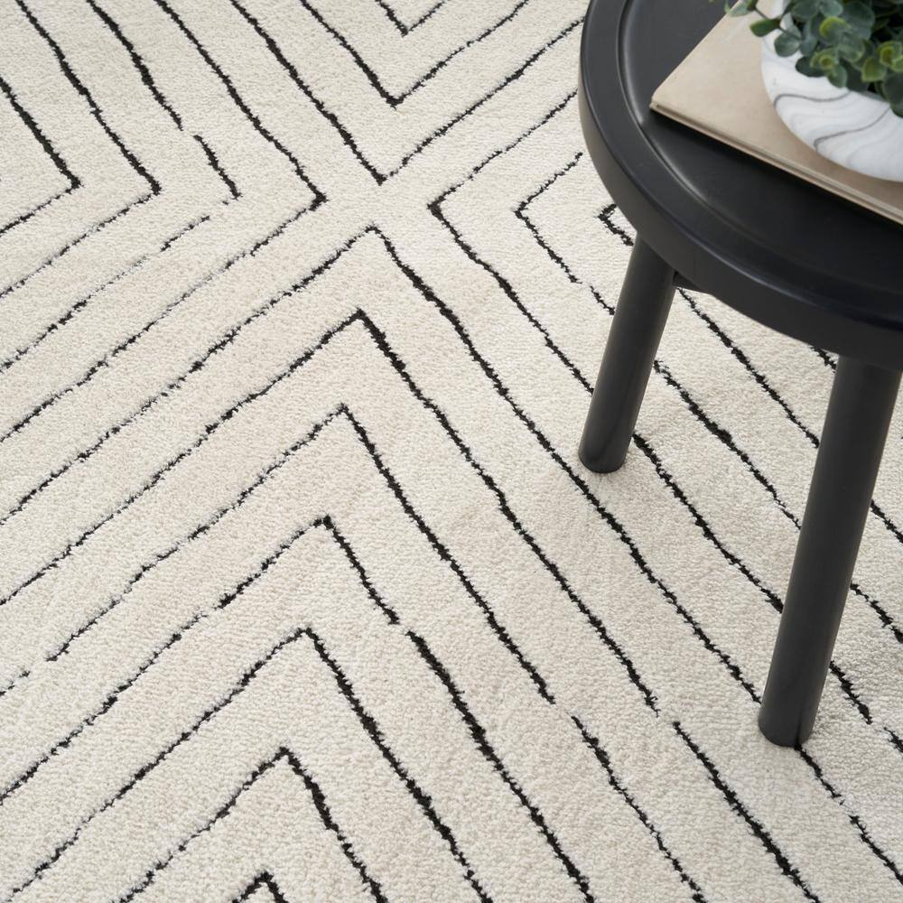 Ivory and Black Chevron Striped 5' x 7' Synthetic Area Rug