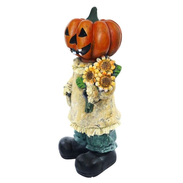 Alpine Corporation 19 in. Pumpkin Lady Holding Sunflower Halloween Decor