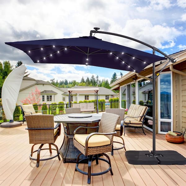 8.2 ft. x 8.2 ft. Solar LED Lighted Square Patio Cantilever Umbrella With a Base in Navy Blue