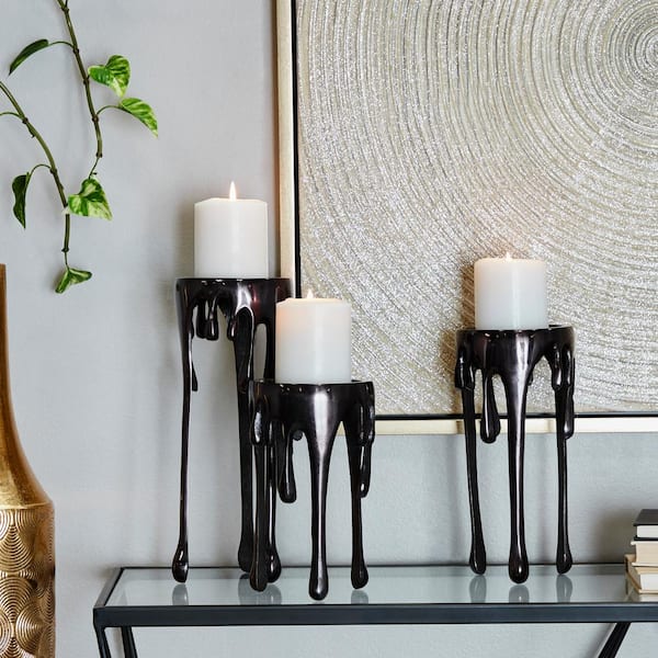 CosmoLiving by Cosmopolitan Black Aluminum Pillar Candle Holder with Dripping Melting Designed Legs (Set of 3)