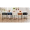 Five bar stools in various colors at a kitchen island.