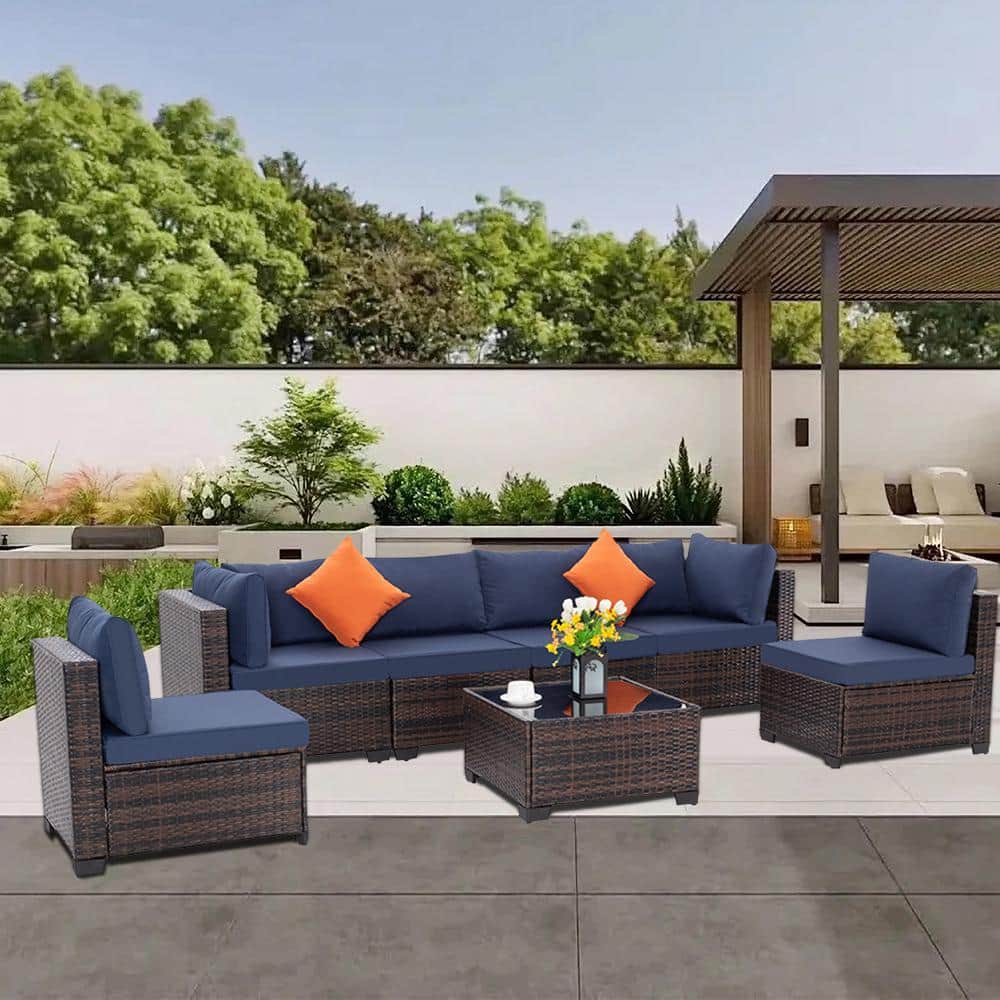 7-Piece Brown Wicker Outdoor Sectional Set with Blue Cushions and Coffee Ta