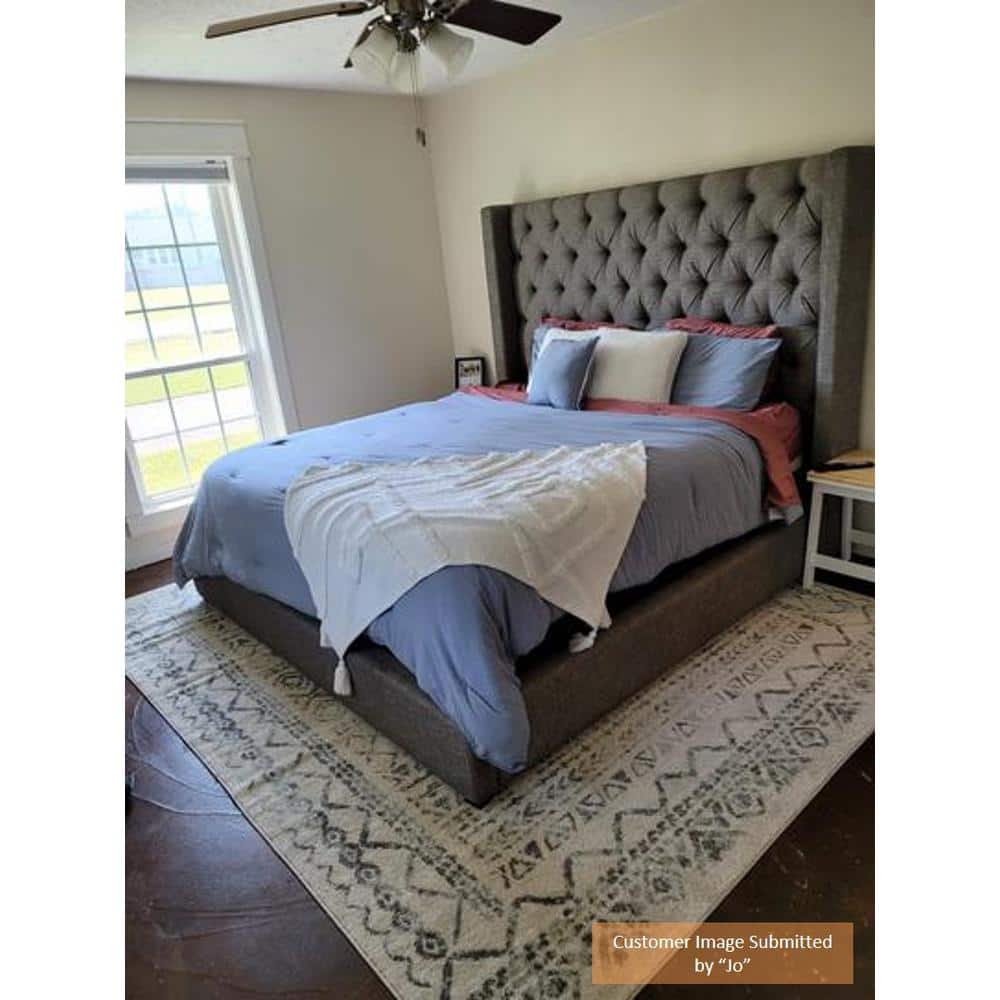 Ivory Rectangular 9' x 12' Stain-Resistant Synthetic Area Rug