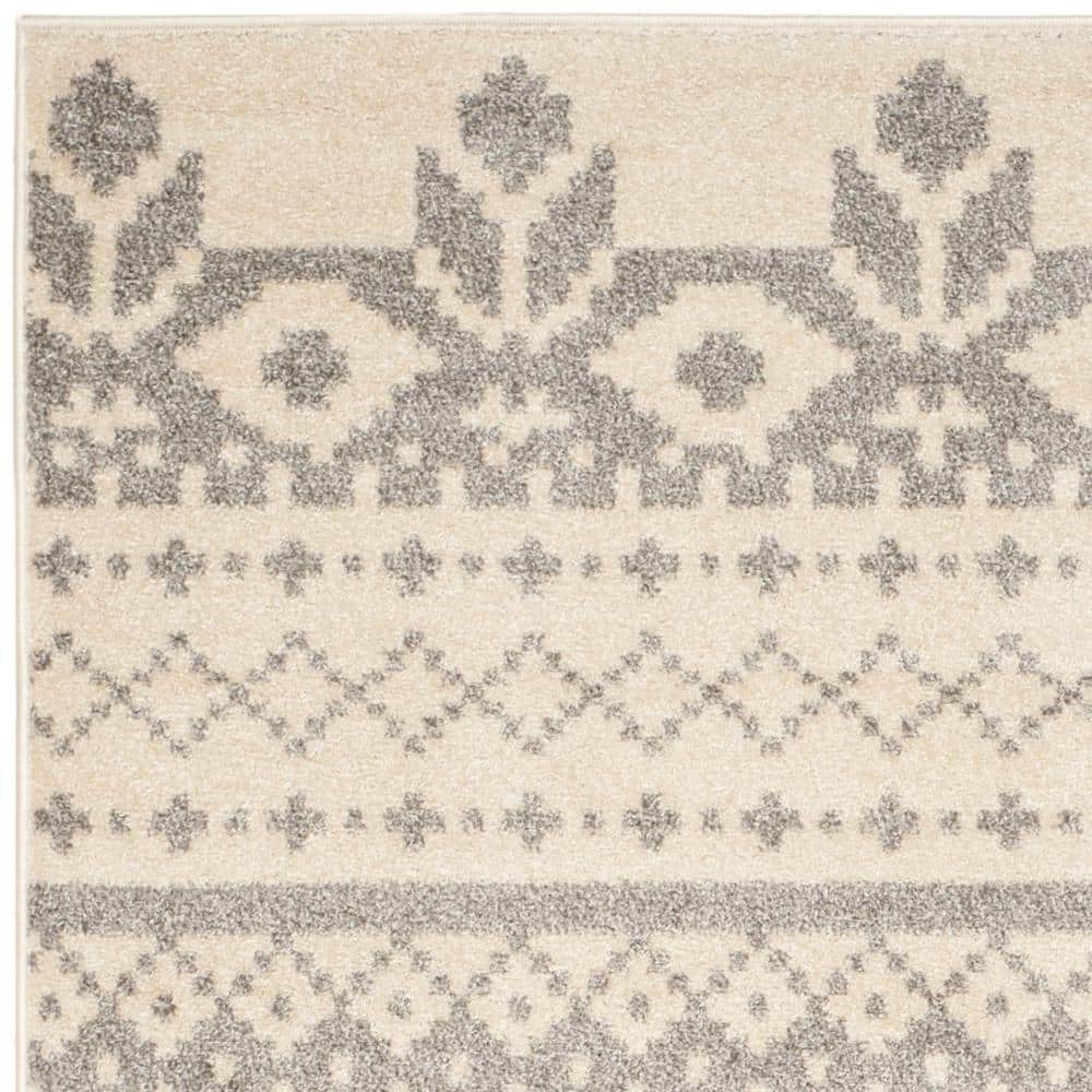 Chic Ivory & Silver Synthetic 10' x 14' Easy-Care Area Rug