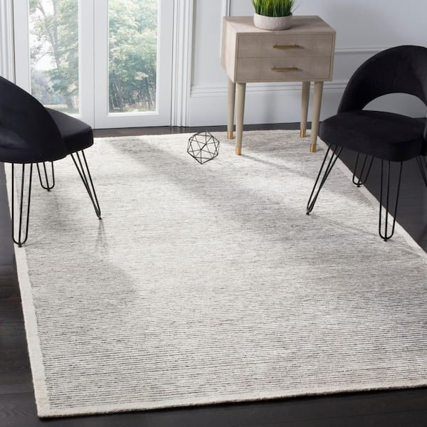 Tibetan 6 ft. x 9 ft. Ivory Solid Color Area Rug