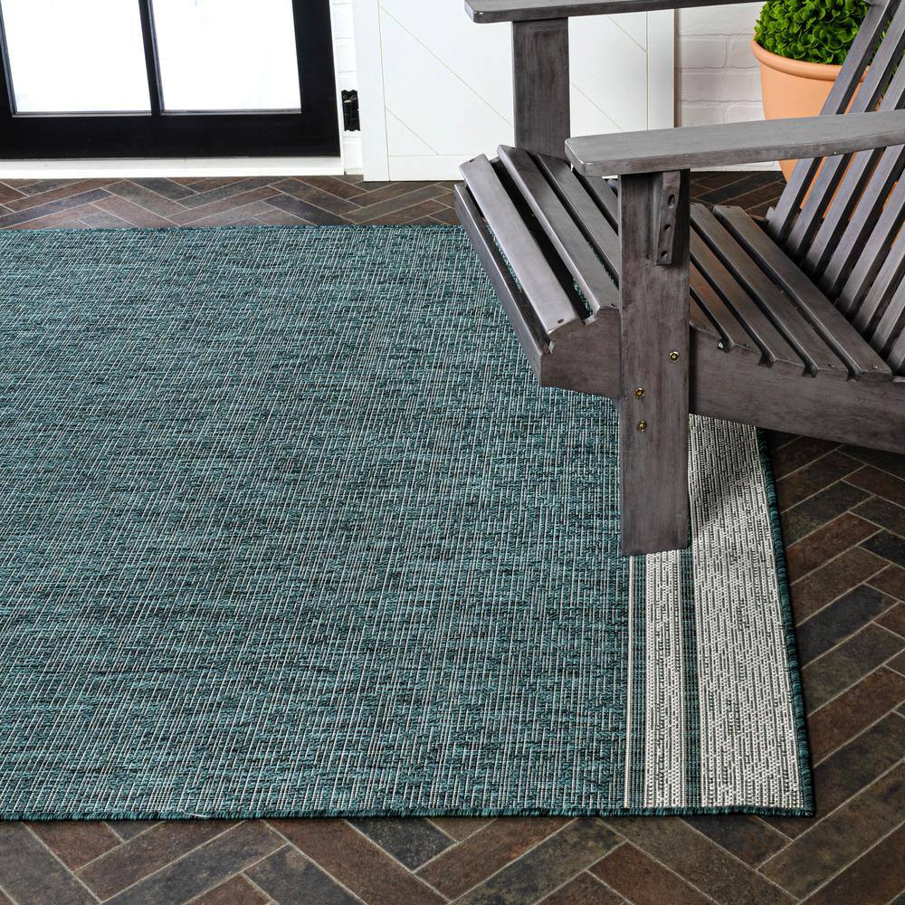 Turquoise and Cream 4' x 6' Solid Synthetic Area Rug