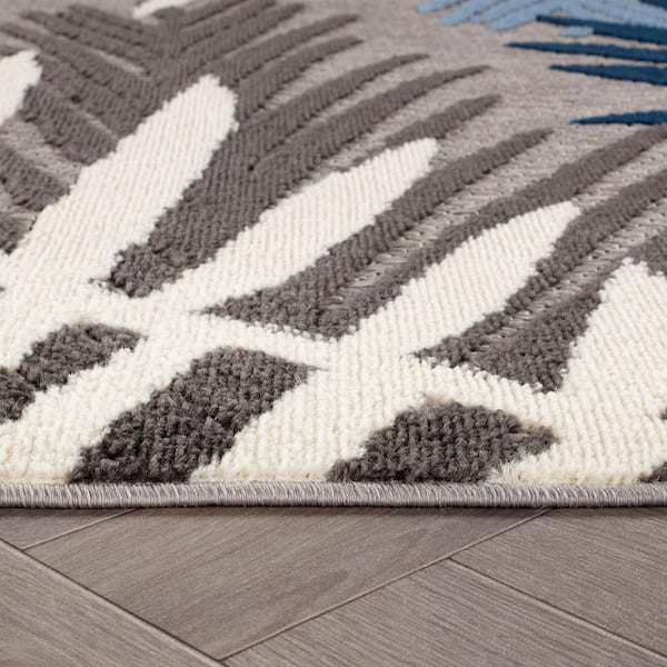 Evora Palm Frond Blue 6 ft. 6 in. x 9 ft. Indoor/Outdoor Area Rug