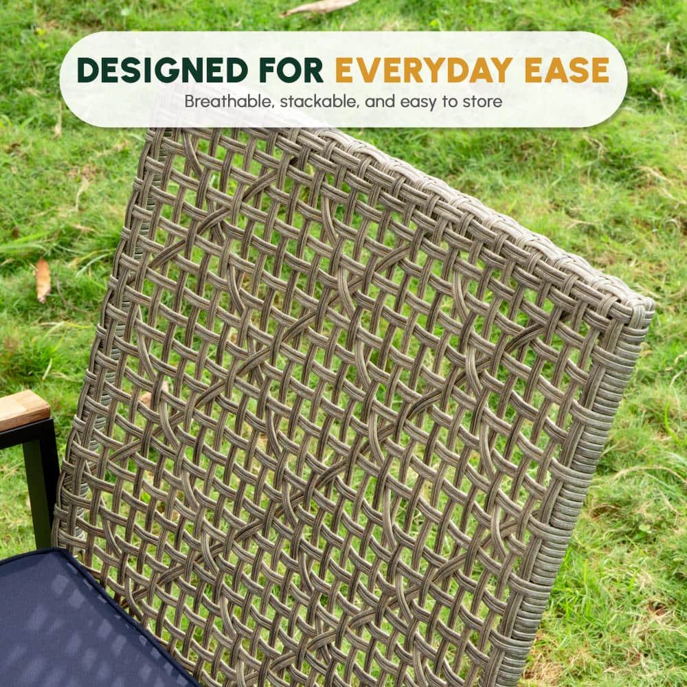 Detail shot of the woven texture and blue fabric of an outdoor chair.